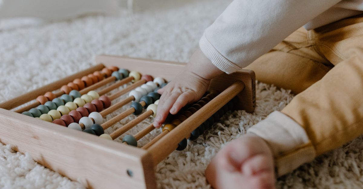 A timeline of child development milestones shown alongside a child engaged in age-appropriate Montessori activity