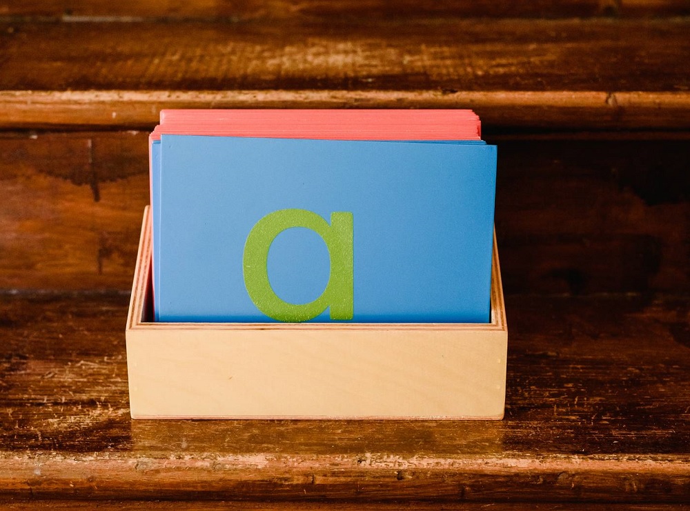 Montessori Sandpaper Letters in a wooden box, the material that links each letter sound to its written shape