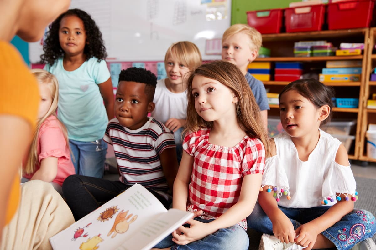 Parent and child visiting a Montessori school classroom during a tour