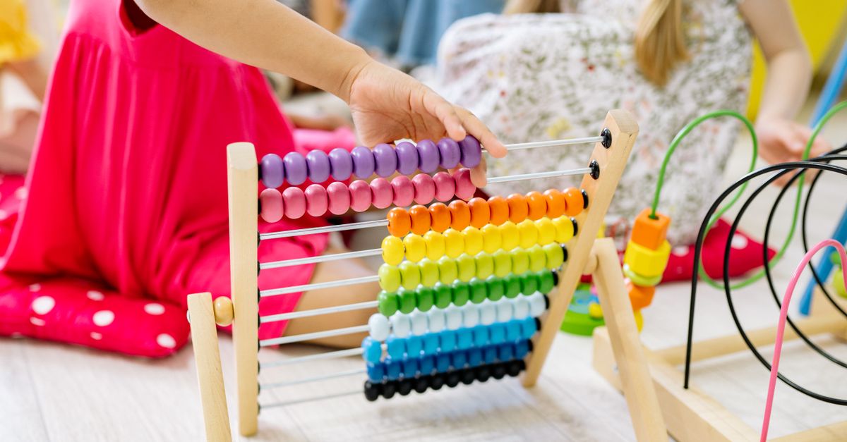The Montessori Bead Frame, a wooden abacus with rows of colored beads used for elementary place value work